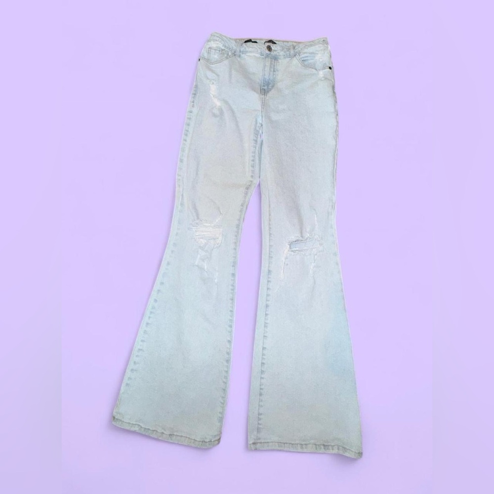 light wash high-rise flared ripped jeans